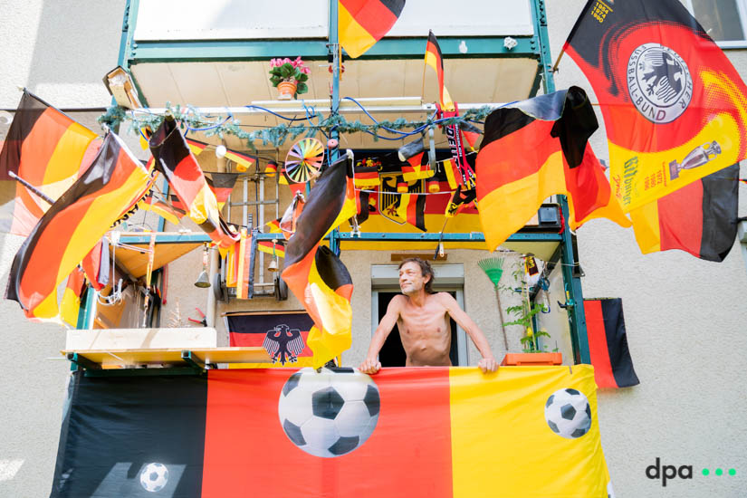 German Football fan Markus Lessow on his balcony