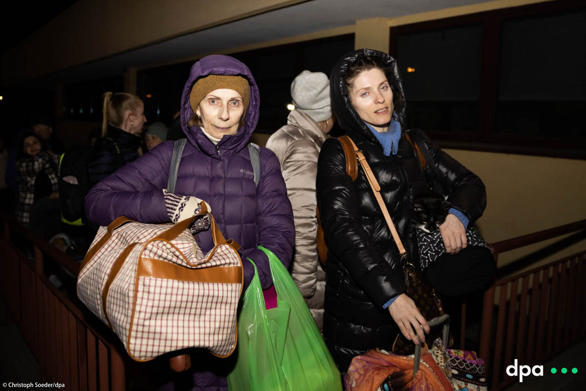 Tamara (l) an her daughter Irina wait at the train station of Przemysl in Poland for their train to Kiev.