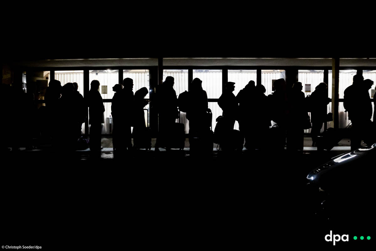 People wait at the train station of Przemysl in Poland for passport control to board a train to Kiev.