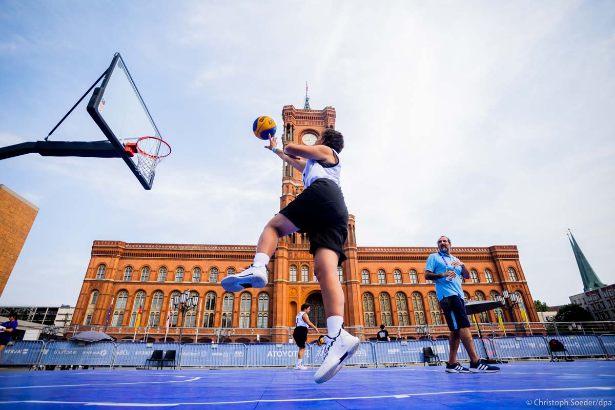 Basketball players from Uruguay warm up in front of Berlin City Hall.